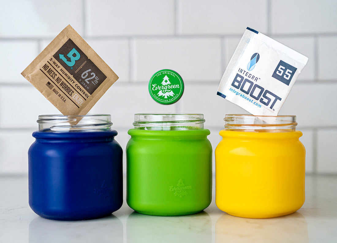 Three Evergreen jars with Boveda, Evergreen, and Integra humidity packs