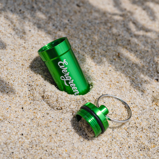 Evergreen Pod travel keychain (traveler) open on beach